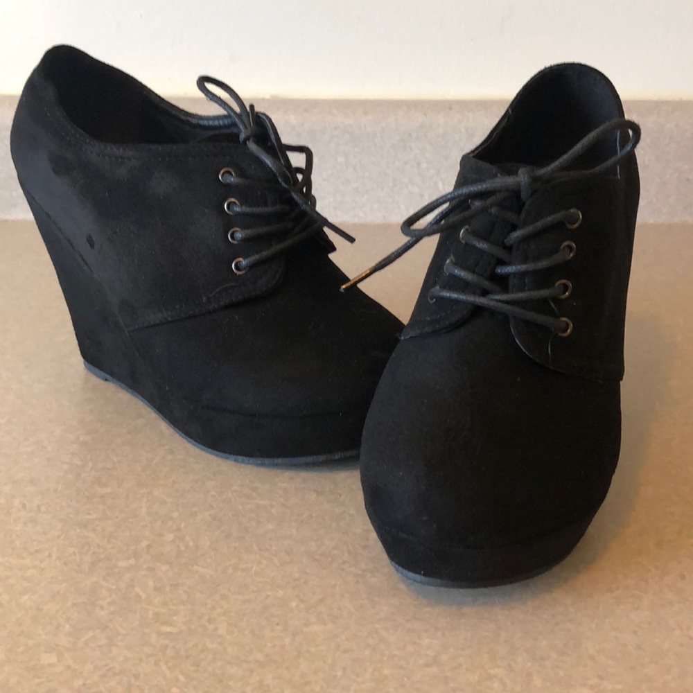 Black Faux suede lace up ankle booties.